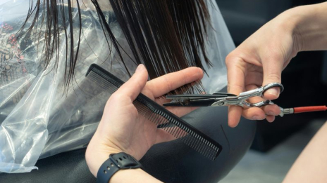 Woman getting a haircut at a beauty salon
